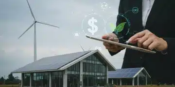 Professional reviewing Inflation Reduction Act clean energy loan documents for project funding