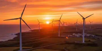 Wind turbines at sunset, symbolizing US wind power growth by 2026